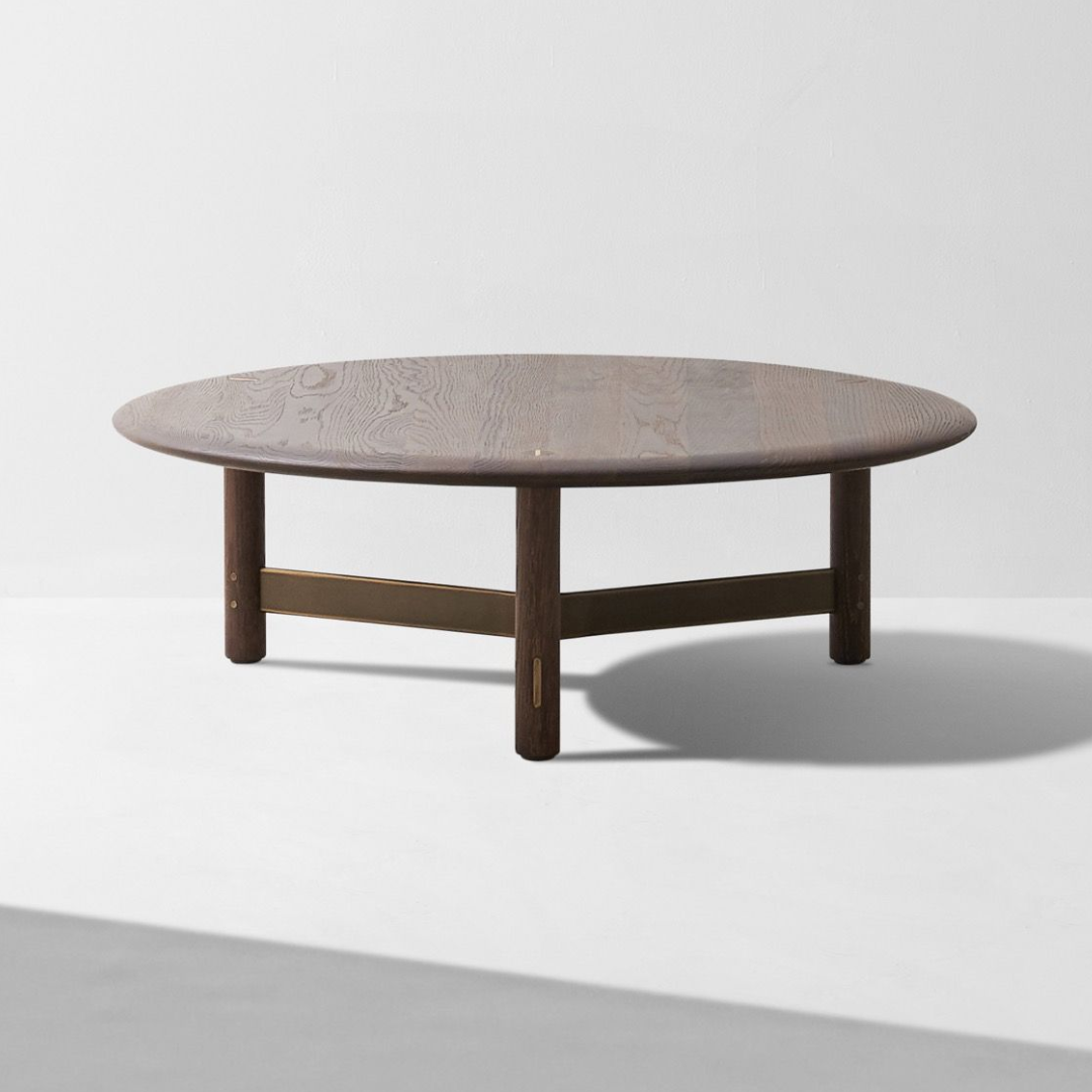 Round wooden coffee table with a textured surface on a white background #Timber Finishing_Ebonized Oak